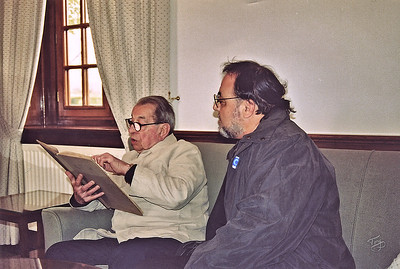Brittany American Cemetery 2004 Memorial Day - Dad reading the logbook, relives old times, as I look on.